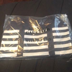 Blk/white Jean Paul Gaultier Weekend Bag.